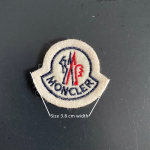 Moncler fake best sale badge